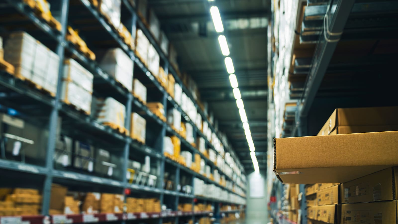 Stack of cardboard boxes in smart warehouse industry logistic.