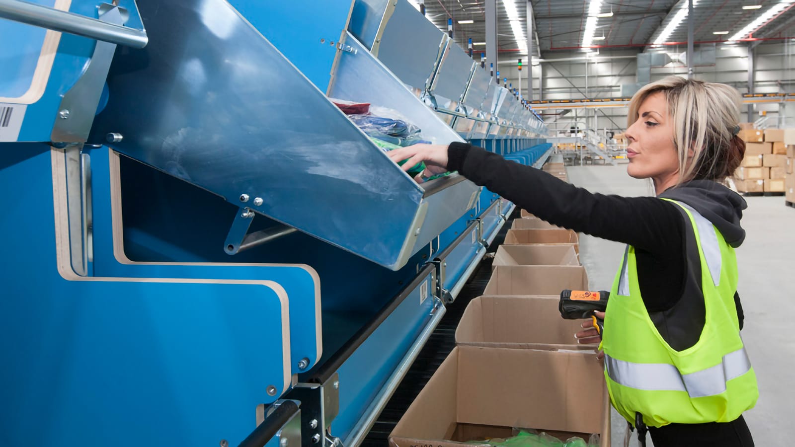 Woman pulling goods at station